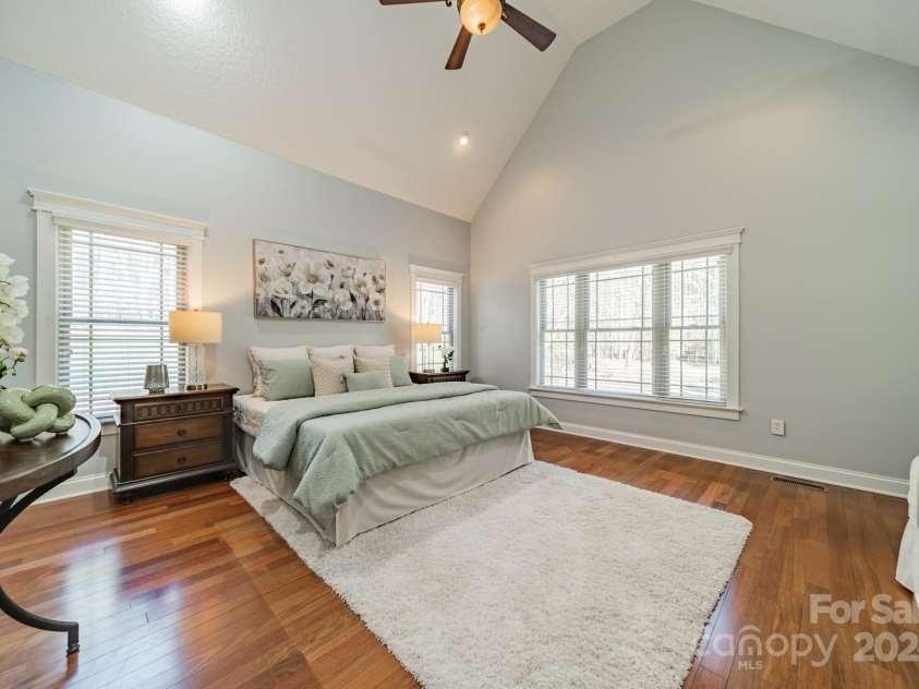 165 Blue Ridge Trail, Mooresville, NC 28117.  MLS# CAR4225294, YatesRealty ID 18540. First floor Primary bedroom with vaulted ceilings and hardwood floors.