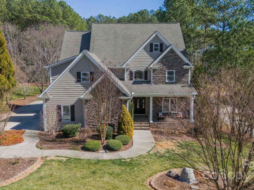 165 Blue Ridge Trail, Mooresville, NC 28117.  MLS# CAR4225294, YatesRealty ID 18540. Front of home and large driveway.