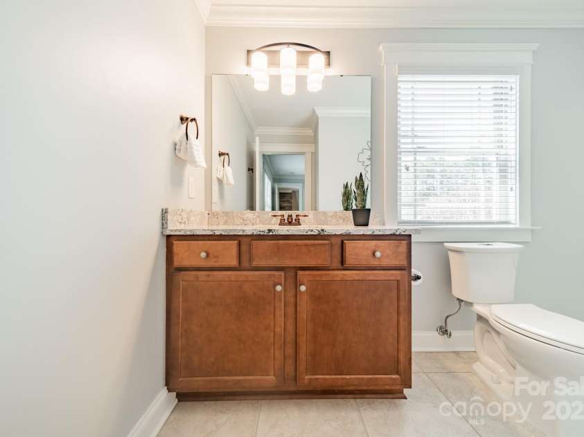 165 Blue Ridge Trail, Mooresville, NC 28117.  MLS# CAR4225294, YatesRealty ID 18540. New quartz counters, lighting and toilet in full ensuite bath.