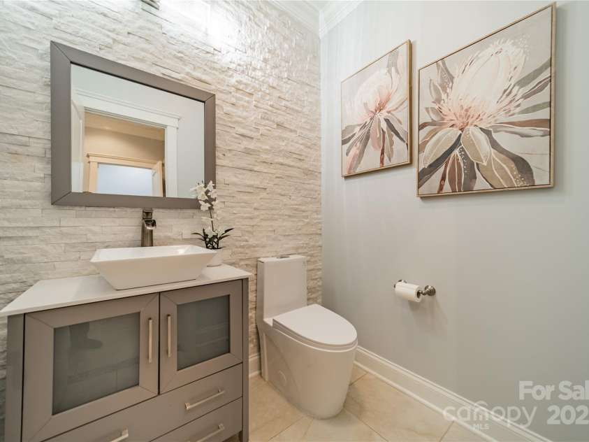 165 Blue Ridge Trail, Mooresville, NC 28117.  MLS# CAR4225294, YatesRealty ID 18540. Renovated downstairs powder room with beautiful stone wall.