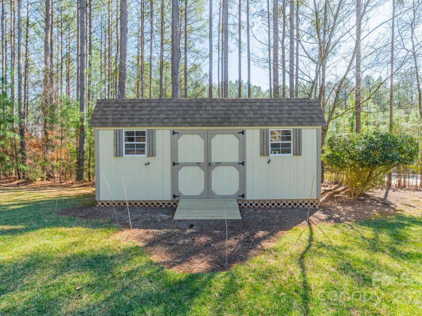 165 Blue Ridge Trail, Mooresville, NC 28117.  MLS# CAR4225294, YatesRealty ID 18540. Shed toward the back of the yard.