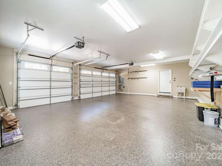 165 Blue Ridge Trail, Mooresville, NC 28117.  MLS# CAR4225294, YatesRealty ID 18540. Three car garage with an epoxy floor.