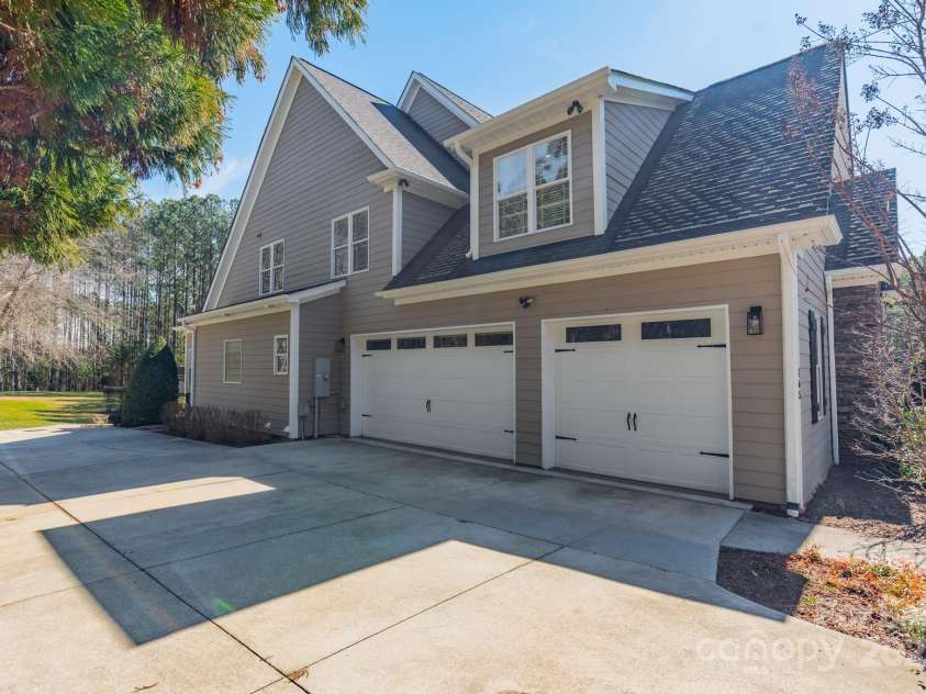 165 Blue Ridge Trail, Mooresville, NC 28117.  MLS# CAR4225294, YatesRealty ID 18540. Three car garage with large cement pad for additional parking.