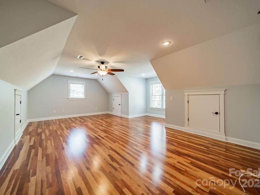 165 Blue Ridge Trail, Mooresville, NC 28117.  MLS# CAR4225294, YatesRealty ID 18540. Upstairs bonus room with 3 attic storage areas.