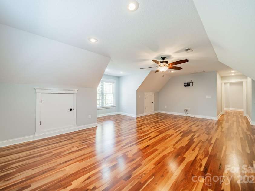 165 Blue Ridge Trail, Mooresville, NC 28117.  MLS# CAR4225294, YatesRealty ID 18540. Upstairs bonus room with Brazilian hardwood floors. There is also a large walk in closet.