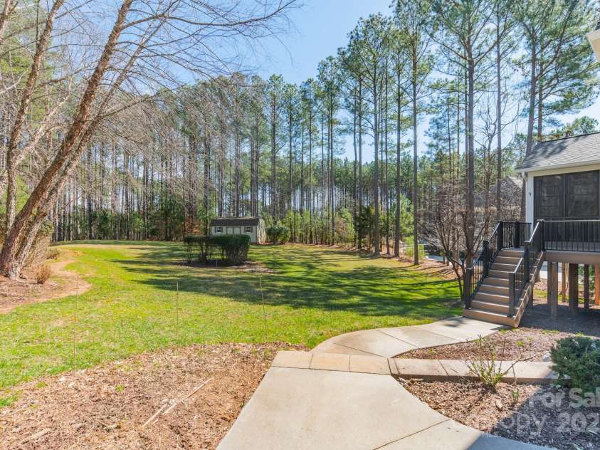 165 Blue Ridge Trail, Mooresville, NC 28117.  MLS# CAR4225294, YatesRealty ID 18540. View of large backyard, almost an acre