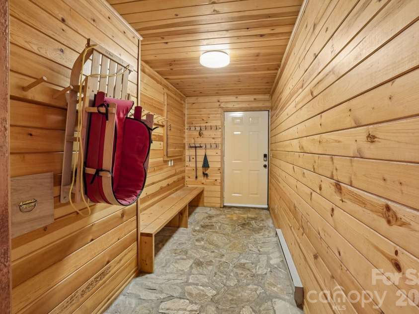 34 Wolfs Head Court, Mars Hill, NC 28754.  MLS# CAR4359563, YatesRealty ID 18544. Mud Room Lower Level/ Access to Outside