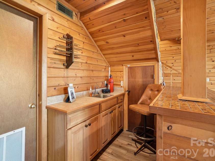 34 Wolfs Head Court, Mars Hill, NC 28754.  MLS# CAR4359563, YatesRealty ID 18544. Wet Bar/ Family Room