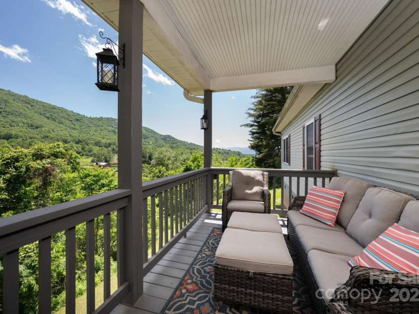 174 Diamond Point, Canton, NC 28716.  MLS# CAR4261296, YatesRealty ID 18548. Side Porch Overlooking the Mountains