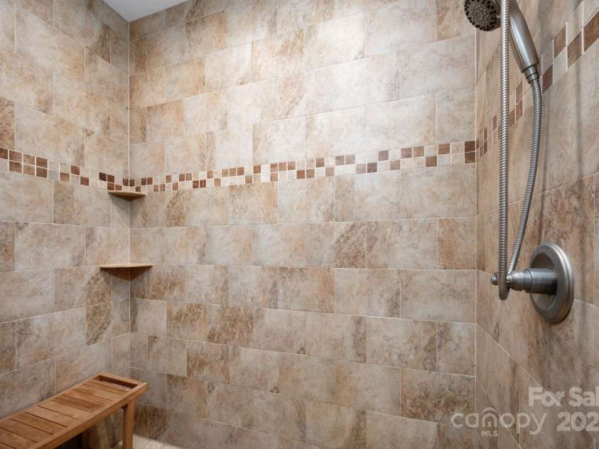 174 Diamond Point, Canton, NC 28716.  MLS# CAR4261296, YatesRealty ID 18548. Spacious shower with beautiful tile