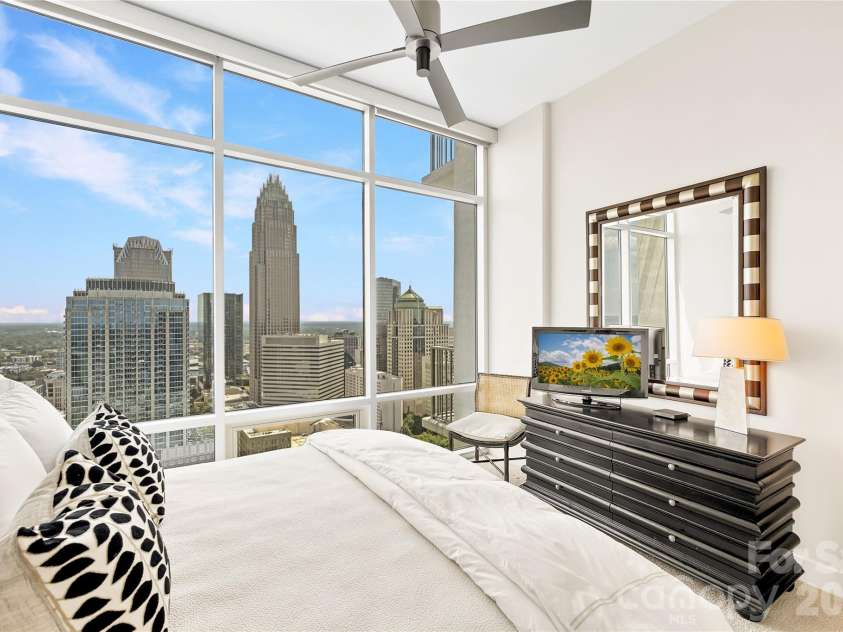 215 Pine Street, Charlotte, NC 28202.  MLS# CAR4186939, YatesRealty ID 18554. Comfortable guest suite with skyline views