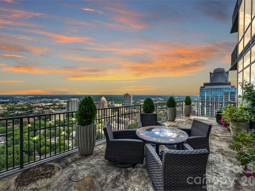 215 Pine Street, Charlotte, NC 28202.  MLS# CAR4186939, YatesRealty ID 18554. Evening views across Uptown Charlotte
