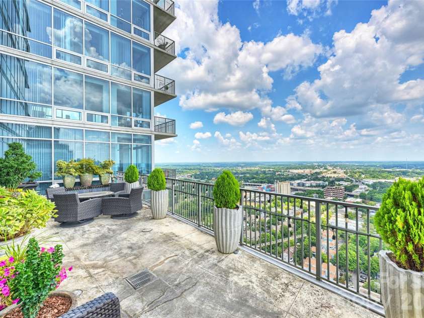 215 Pine Street, Charlotte, NC 28202.  MLS# CAR4186939, YatesRealty ID 18554. Outdoor living high above Uptown