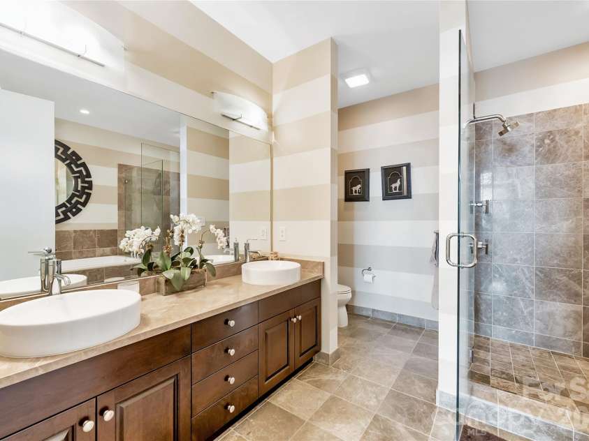 215 Pine Street, Charlotte, NC 28202.  MLS# CAR4186939, YatesRealty ID 18554. Primary bath with walk-in shower