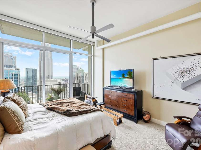 215 Pine Street, Charlotte, NC 28202.  MLS# CAR4186939, YatesRealty ID 18554. Primary suite overlooking Uptown