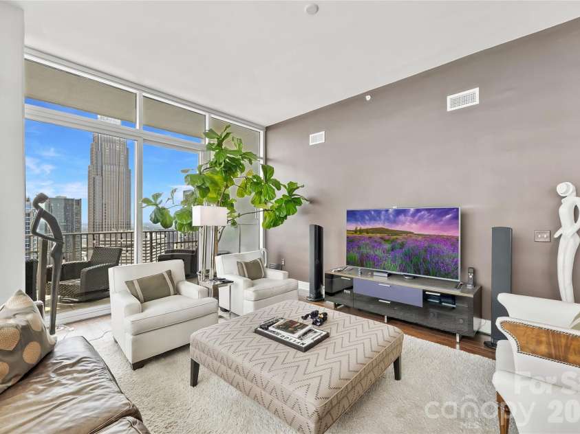 215 Pine Street, Charlotte, NC 28202.  MLS# CAR4186939, YatesRealty ID 18554. Spacious living room with incredible natural light