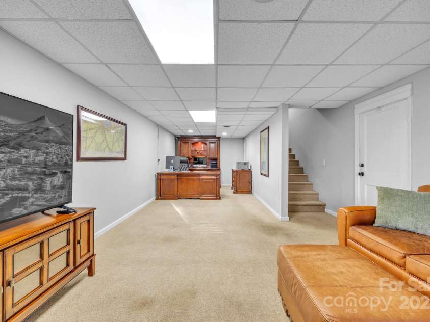 651 25th Avenue, Hickory, NC 28601.  MLS# CAR4316987, YatesRealty ID 18559. Finished lower-level area offers flexible space for media, playroom or exercise — built to adapt as your lifestyle does.