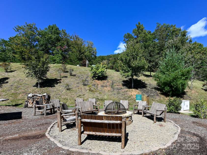 29 Stills Creek Loop, Fairview, NC 28730.  MLS# CAR4226327, YatesRealty ID 18560. Community Firepit in the Summer Greenery (PreHelene Pic)