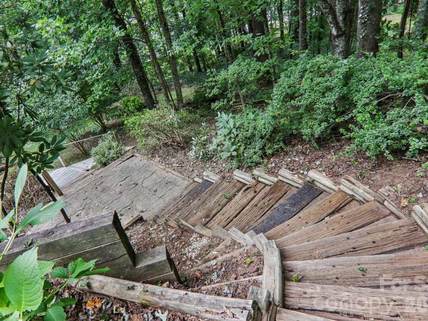702 Cinnamon Way, Flat Rock, NC 28731.  MLS# CAR4373654, YatesRealty ID 18560. Steps down to side & back yard