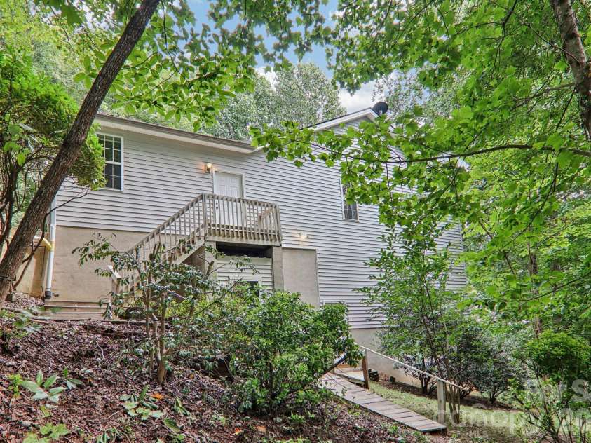 702 Cinnamon Way, Flat Rock, NC 28731.  MLS# CAR4373654, YatesRealty ID 18560. View from side yard