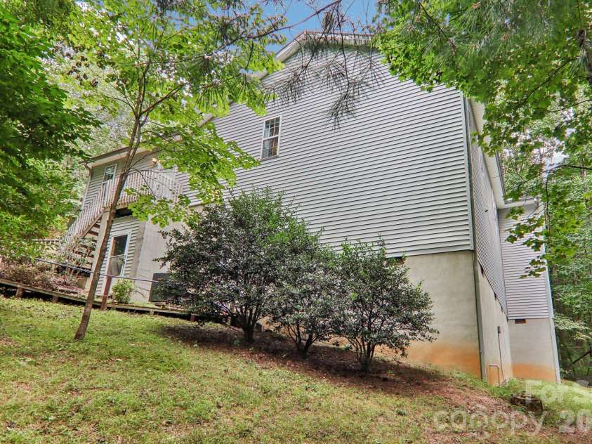 702 Cinnamon Way, Flat Rock, NC 28731.  MLS# CAR4373654, YatesRealty ID 18560. View from side yard