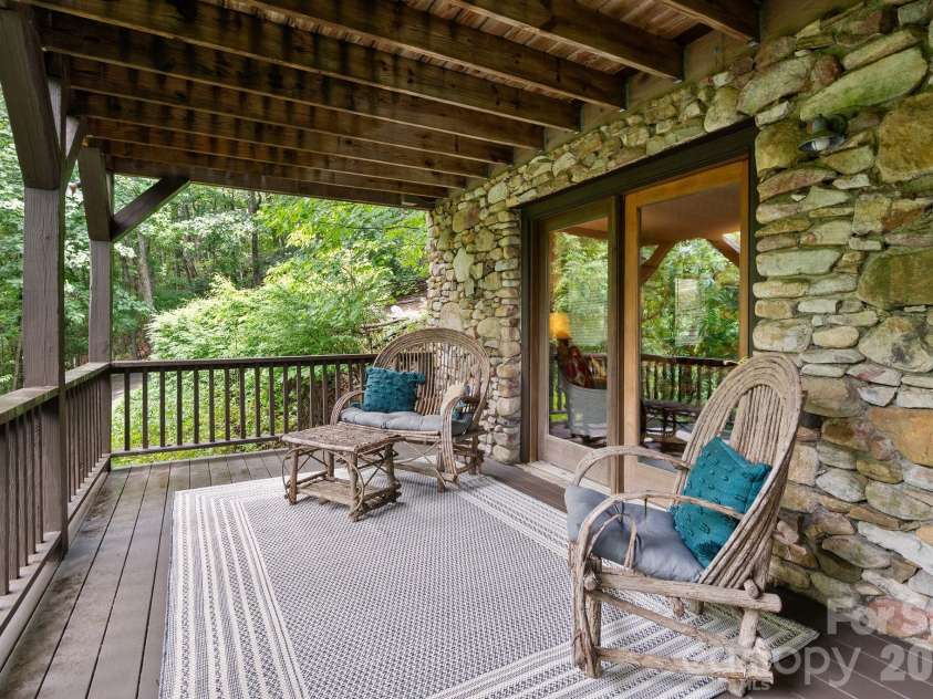 65 Sugar Maple Drive, Mills River, NC 28759.  MLS# CAR4357301, YatesRealty ID 18562. Off the lower den is another deck access to an additional seating area. Watch the deer parade by as you relax!