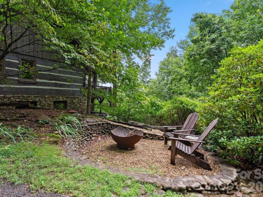 65 Sugar Maple Drive, Mills River, NC 28759.  MLS# CAR4357301, YatesRealty ID 18562. Outdoor firepit is a wonderful gathering spot!