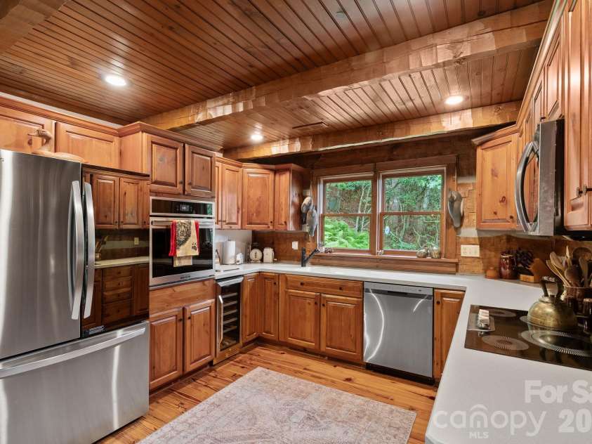 65 Sugar Maple Drive, Mills River, NC 28759.  MLS# CAR4357301, YatesRealty ID 18562. Plenty of storage and counterspace in this cozy kitchen!