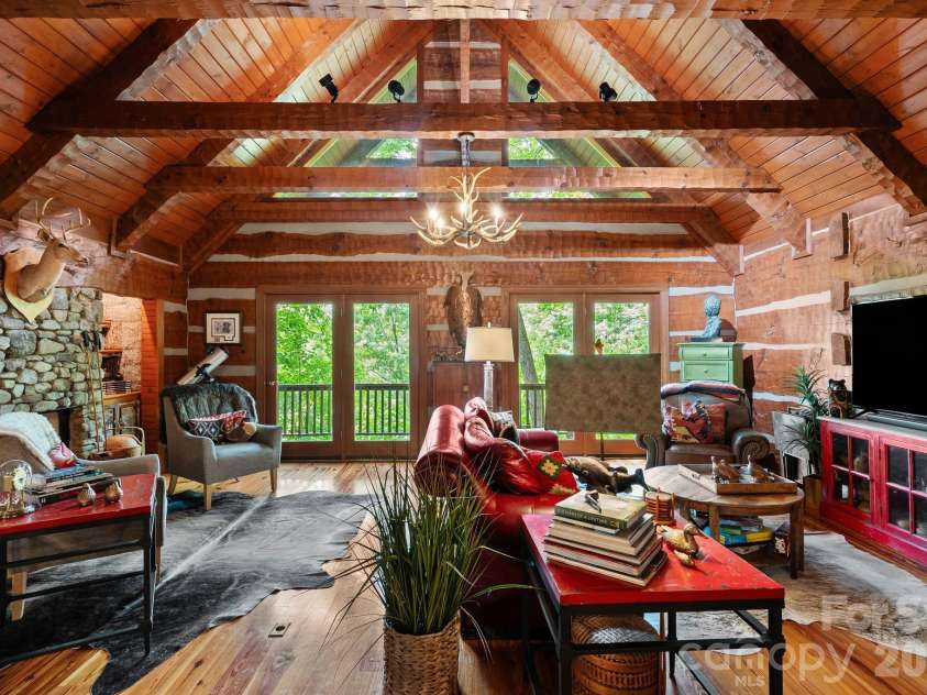 65 Sugar Maple Drive, Mills River, NC 28759.  MLS# CAR4357301, YatesRealty ID 18562. The vaulted ceiling and hand hewn beams create a true 