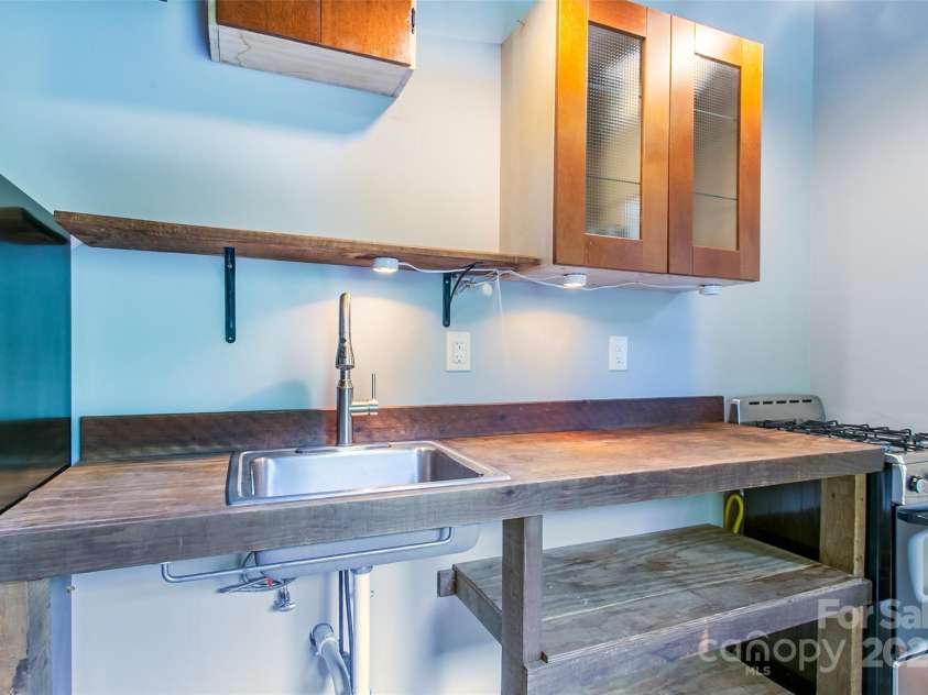 1146 Thomas Branch Road, Marshall, NC 28753.  MLS# CAR4307630, YatesRealty ID 18563. Flex space living and kitchen