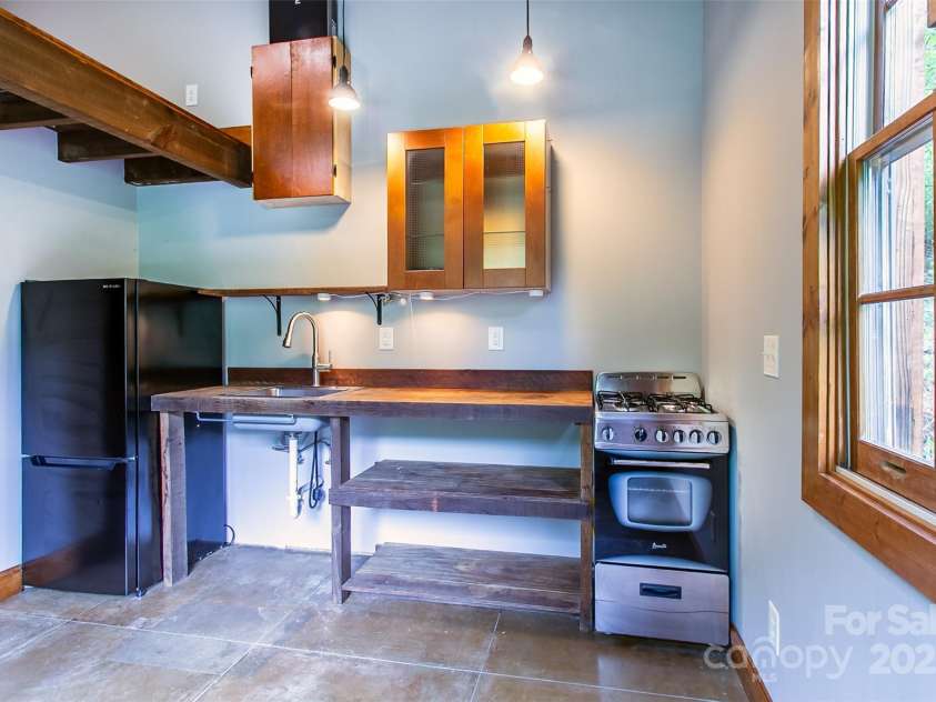 1146 Thomas Branch Road, Marshall, NC 28753.  MLS# CAR4307630, YatesRealty ID 18563. Flex space living and kitchen