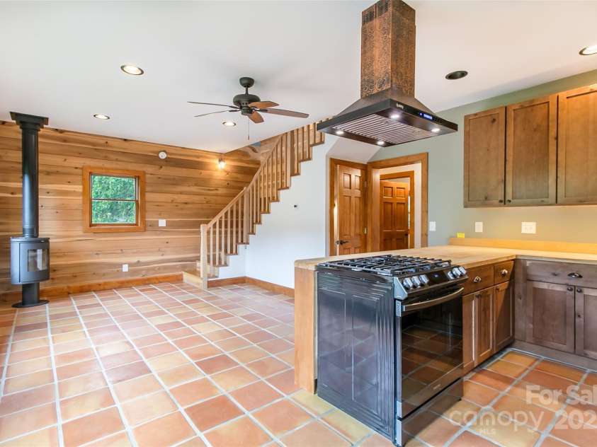 1146 Thomas Branch Road, Marshall, NC 28753.  MLS# CAR4307630, YatesRealty ID 18563. Kitchen and living views