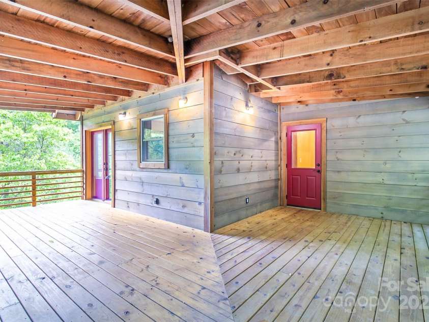 1146 Thomas Branch Road, Marshall, NC 28753.  MLS# CAR4307630, YatesRealty ID 18563. Wrap around deck