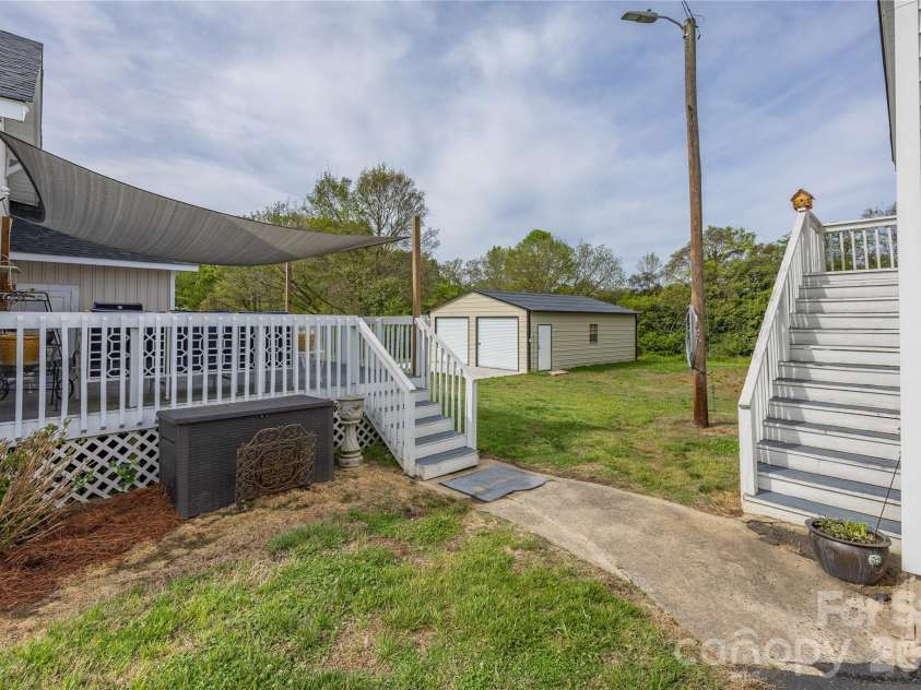 271 Main Street, Denton, NC 27239.  MLS# CAR4404890, YatesRealty ID 18566. Walkway from back deck to garage