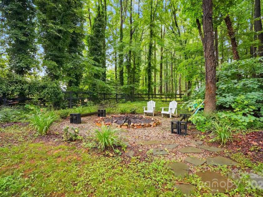 8708 Piccone Brook Lane, Charlotte, NC 28216.  MLS# CAR4267113, YatesRealty ID 18568. Fire pit in backyard