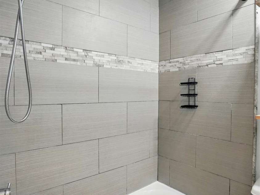 8708 Piccone Brook Lane, Charlotte, NC 28216.  MLS# CAR4267113, YatesRealty ID 18568. Real Tile Walls with mosaic inlaid design in guest bathroom