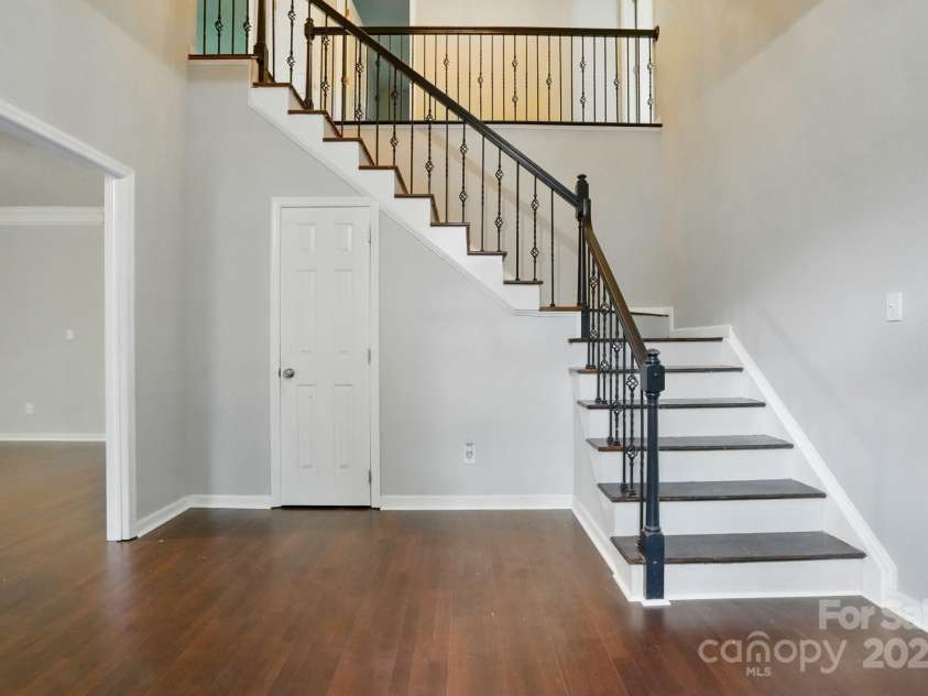 8708 Piccone Brook Lane, Charlotte, NC 28216.  MLS# CAR4267113, YatesRealty ID 18568. Upgraded bannisters and newly installed floors