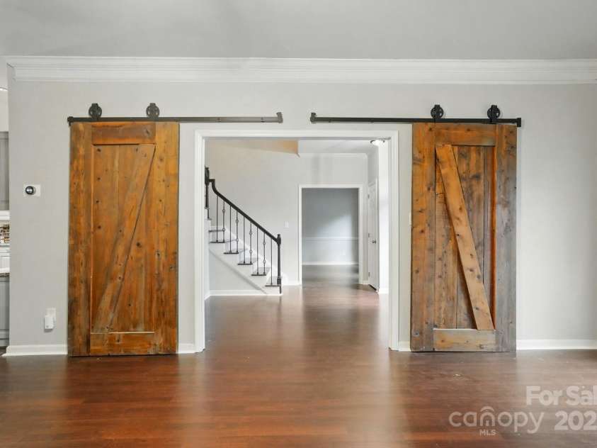 8708 Piccone Brook Lane, Charlotte, NC 28216.  MLS# CAR4267113, YatesRealty ID 18568. View of foyer through family room