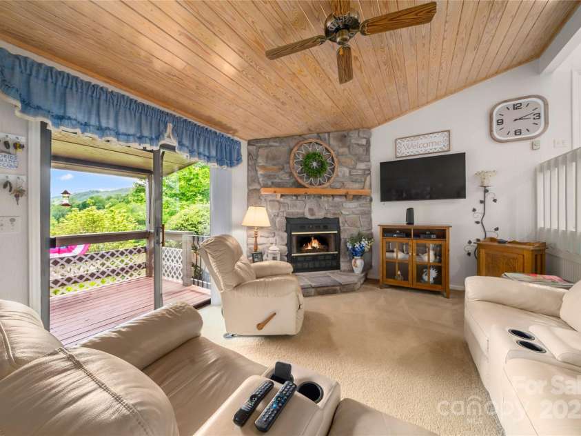 131 Apple Blossom Lane, Maggie Valley, NC 28751.  MLS# CAR4265861, YatesRealty ID 18577. A View and the Fireplace are the Hearth of the Home