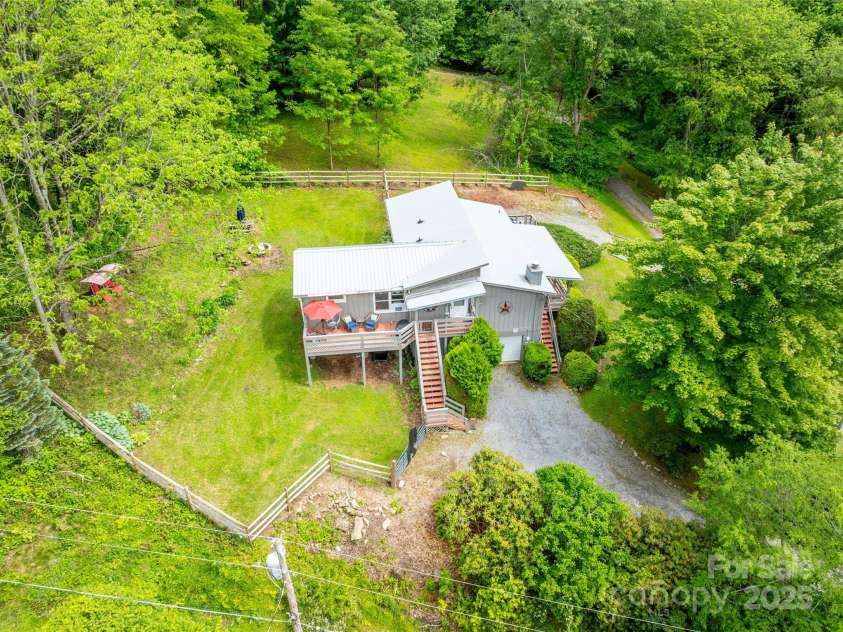 131 Apple Blossom Lane, Maggie Valley, NC 28751.  MLS# CAR4265861, YatesRealty ID 18577. Fenced back yard