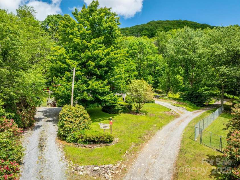 131 Apple Blossom Lane, Maggie Valley, NC 28751.  MLS# CAR4265861, YatesRealty ID 18577. Two driveways to the house