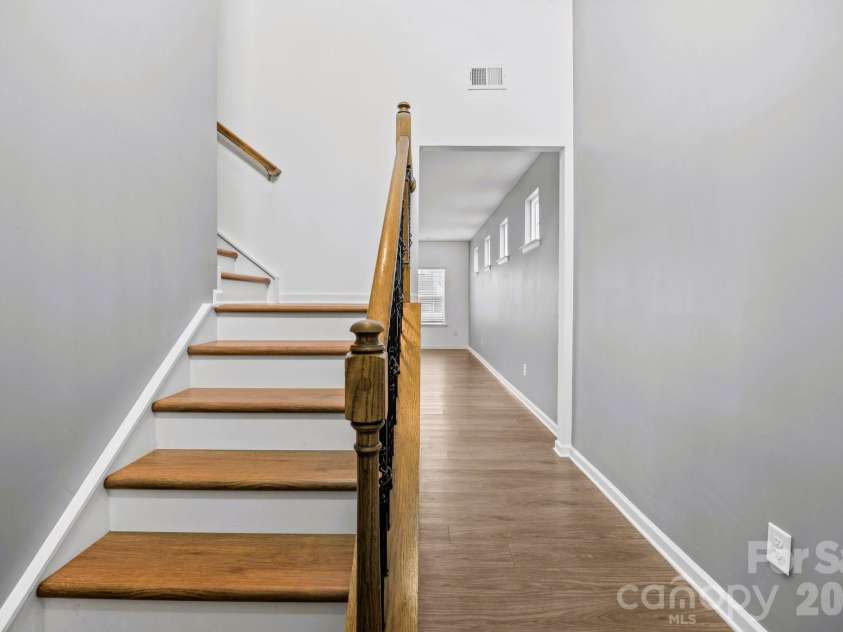 5775 Soft Shell Drive, Lancaster, SC 29720.  MLS# CAR4340561, YatesRealty ID 18593. Wooden steps stairs & Iron Rod Railing