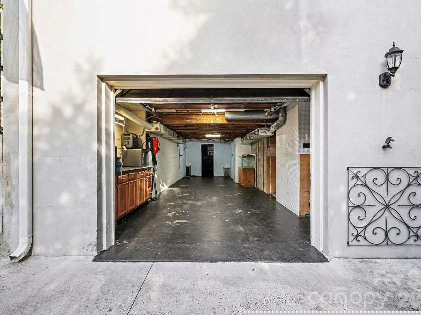 123 Old Bell Road, Charlotte, NC 28270.  MLS# CAR4333657, YatesRealty ID 18610. 2-car tadem garage, and doorway to your heated and air conditioned workshop.