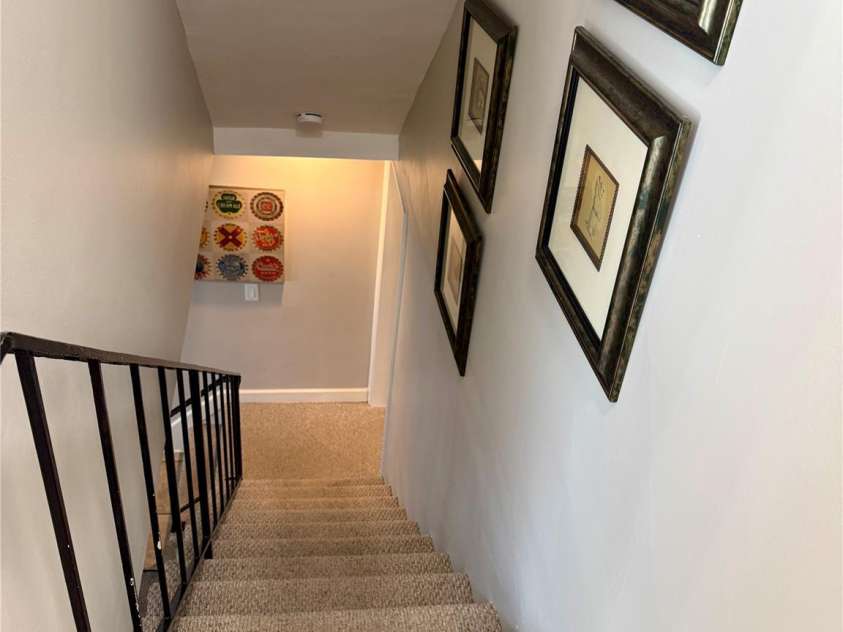 123 Old Bell Road, Charlotte, NC 28270.  MLS# CAR4333657, YatesRealty ID 18610. Stairway from the main level down to the lower level, to your 4th bedroom, 3rd full bathroom, 5th entrance from the outside and entrance to the garage.