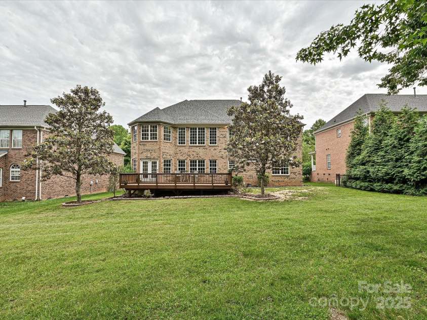 410 Deer Brush Lane, Waxhaw, NC 28173.  MLS# CAR4258859, YatesRealty ID 18616. Large, leveled yard with beautiful magnolia tress!