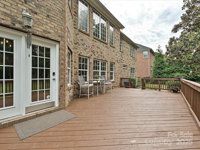 410 Deer Brush Lane, Waxhaw, NC 28173.  MLS# CAR4258859, YatesRealty ID 18616. Oversized deck overlooks flat and heavily wooded yard!