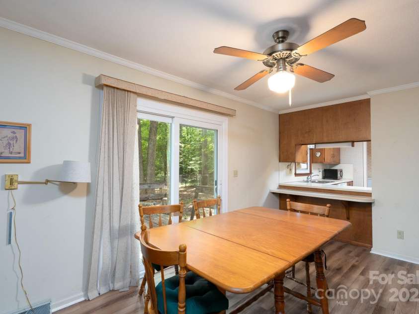 403 Cherrywood Lane, Albemarle, NC 28001.  MLS# CAR4260137, YatesRealty ID 18644. Dining room with wood burning fireplace