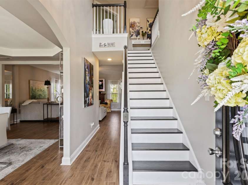 7355 Drury Lane, Denver, NC 28037.  MLS# CAR4365592, YatesRealty ID 18644. Bright foyer with staircase and hardwood floors 