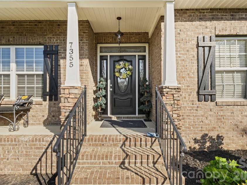 7355 Drury Lane, Denver, NC 28037.  MLS# CAR4365592, YatesRealty ID 18644. Covered Front porch with welcoming entry 