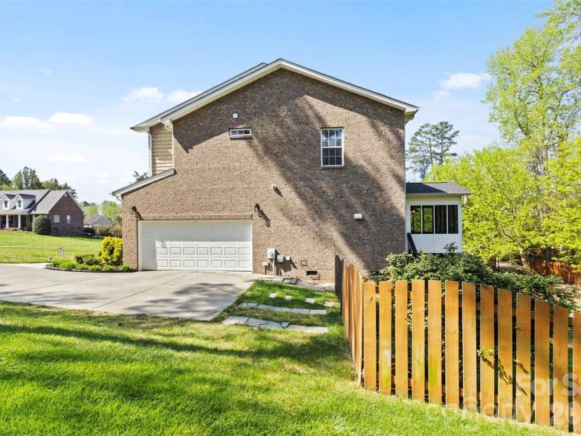 7355 Drury Lane, Denver, NC 28037.  MLS# CAR4365592, YatesRealty ID 18644. Side-load yard with fenced yard access